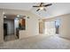 Bright living room featuring vaulted ceiling, a ceiling fan and a sliding door to the outside at 200 E Southern Ave # 368, Tempe, AZ 85282