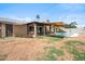 Inviting backyard features a refreshing pool, covered patio, and ample space for outdoor relaxation and entertainment at 2009 W Morningside Dr, Phoenix, AZ 85023
