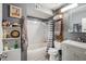 Well-organized bathroom with a shower-tub combo, modern vanity, and decorative shelving at 2009 W Morningside Dr, Phoenix, AZ 85023