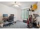 Bedroom converted to home gym with desk and weight training equipment at 2009 W Morningside Dr, Phoenix, AZ 85023