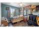 Bedroom with green walls, gray curtains, a mirror, and a bed with a quilt at 2009 W Morningside Dr, Phoenix, AZ 85023