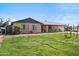 Charming single-story brick home with a well-manicured lawn and attached garage on a sunny day at 2009 W Morningside Dr, Phoenix, AZ 85023