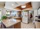 Bright kitchen featuring ample counter space, modern appliances, and a view of the outdoors at 2009 W Morningside Dr, Phoenix, AZ 85023