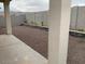View of a low maintenance backyard with decorative rock and retaining walls at 20346 W Sells Dr, Buckeye, AZ 85396