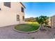 Side yard with decorative gravel, artificial lawn and small gate at 21538 E Alyssa Ct, Queen Creek, AZ 85142