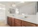 Bright bathroom features a double sink vanity and a large mirror at 21538 E Alyssa Ct, Queen Creek, AZ 85142
