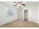 Bedroom featuring neutral carpet, a ceiling fan, window with blinds, and closet at 21538 E Alyssa Ct, Queen Creek, AZ 85142