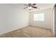 Bedroom features neutral carpet, a ceiling fan, and window with blinds at 21538 E Alyssa Ct, Queen Creek, AZ 85142