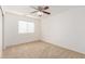 Bedroom with neutral carpet, ceiling fan, and a window with blinds at 21538 E Alyssa Ct, Queen Creek, AZ 85142