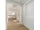 Neutral hallway features a carpeted floor, white walls, and an archway overlooking the staircase at 21538 E Alyssa Ct, Queen Creek, AZ 85142