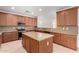 The spacious kitchen features granite countertops, ample cabinetry, and a center island at 21538 E Alyssa Ct, Queen Creek, AZ 85142