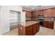 Modern kitchen featuring a pantry, island and granite countertops and stainless steel appliances at 21538 E Alyssa Ct, Queen Creek, AZ 85142
