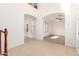 Open living area with tile flooring, arched entryways, and natural light at 21538 E Alyssa Ct, Queen Creek, AZ 85142