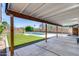 Outdoor space features a covered patio overlooking a pool and a grassy area at 2336 E Flower St, Phoenix, AZ 85016