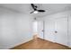 Bedroom with a ceiling fan, wood flooring and white doors at 2336 E Flower St, Phoenix, AZ 85016