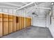 Spacious garage with a paneled wall and a white door at 2336 E Flower St, Phoenix, AZ 85016