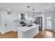 Renovated kitchen featuring a large island, stainless steel appliances, and pendant lighting at 2336 E Flower St, Phoenix, AZ 85016