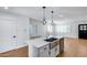 Modern kitchen design with stainless steel appliances and open access to the bright living area at 2336 E Flower St, Phoenix, AZ 85016
