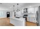 Spacious kitchen with island, stainless steel appliances, and updated cabinets at 2336 E Flower St, Phoenix, AZ 85016