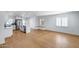 Open concept living space featuring hardwood floors, large windows, and modern decor at 2336 E Flower St, Phoenix, AZ 85016