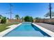 Outdoor pool with an artificial grass border and landscaping at 2336 E Flower St, Phoenix, AZ 85016