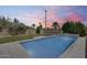 A relaxing pool with professional landscaping, perfect for enjoying sunny days in this private backyard retreat at 2336 E Flower St, Phoenix, AZ 85016