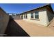 View of the spacious backyard features block fence, landscaping opportunities, and the building's windows at 24146 N 162Nd Ln, Surprise, AZ 85387