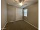 Cozy bedroom with carpeted floors, closet, and natural light from the window at 24146 N 162Nd Ln, Surprise, AZ 85387