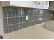 This kitchen features a gray subway tile backsplash and bright white quartz countertops at 24146 N 162Nd Ln, Surprise, AZ 85387