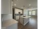 Modern kitchen with quartz countertops, island with sink, and recessed lighting at 24146 N 162Nd Ln, Surprise, AZ 85387
