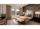 Stylish bedroom with a decorative accent wall, neutral tones, and natural light at 24651 N 127Th Way # 30, Scottsdale, AZ 85255