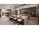 Contemporary kitchen featuring a large marble island with seating and modern lighting at 24651 N 127Th Way # 30, Scottsdale, AZ 85255