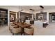 Bright kitchen featuring an island with seating, modern lighting, and stainless steel appliances at 24651 N 127Th Way # 30, Scottsdale, AZ 85255