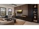 Contemporary living room with neutral palette, sleek built-ins, and outside views at 24651 N 127Th Way # 30, Scottsdale, AZ 85255