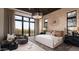 Bright main bedroom with luxurious finishes, large windows, and a comfortable seating area with scenic views at 24651 N 127Th Way # 30, Scottsdale, AZ 85255