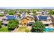 Aerial view showing a two-story home with backyard patio and solar panels in a friendly neighborhood at 283 W Tahiti Dr, Casa Grande, AZ 85122