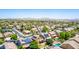 A high angle view looking over a neighborhood with homes, many of which have solar panels at 283 W Tahiti Dr, Casa Grande, AZ 85122