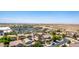 A high angle view of a neighborhood with local shopping and mountain views at 283 W Tahiti Dr, Casa Grande, AZ 85122