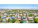 A high angle view of many homes in a neighborhood, each with solar panels at 283 W Tahiti Dr, Casa Grande, AZ 85122
