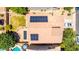 Aerial view of a home with a pool, patio, lawn and solar panels on the roof at 283 W Tahiti Dr, Casa Grande, AZ 85122