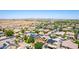 An aerial view of a community featuring many homes with solar panels on the roofs at 283 W Tahiti Dr, Casa Grande, AZ 85122