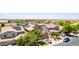 Aerial view of a suburban neighborhood with solar panels and well-maintained landscaping at 283 W Tahiti Dr, Casa Grande, AZ 85122