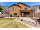 Large backyard boasts a covered patio, fire pit, grill, and ample space for outdoor activities at 283 W Tahiti Dr, Casa Grande, AZ 85122