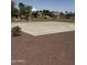 Outdoor basketball court features manicured landscaping in a well-maintained community at 283 W Tahiti Dr, Casa Grande, AZ 85122