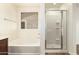 A well-lit bathroom featuring a separate shower and tub with a window at 283 W Tahiti Dr, Casa Grande, AZ 85122