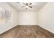 This bedroom features a window with blinds and ceiling fan at 283 W Tahiti Dr, Casa Grande, AZ 85122