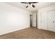 Neutral bedroom with a closet, ceiling fan, and a doorway, offering easy access at 283 W Tahiti Dr, Casa Grande, AZ 85122