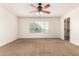 Bedroom with ceiling fan and natural light at 283 W Tahiti Dr, Casa Grande, AZ 85122