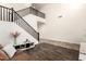 Bright living room with staircase, featuring wood floors and white walls, blending modern design with spacious living at 283 W Tahiti Dr, Casa Grande, AZ 85122