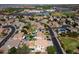 Neighborhood aerial view highlights swimming pools, green spaces, and the surrounding community amenities at 2880 E Nunneley Rd, Gilbert, AZ 85296